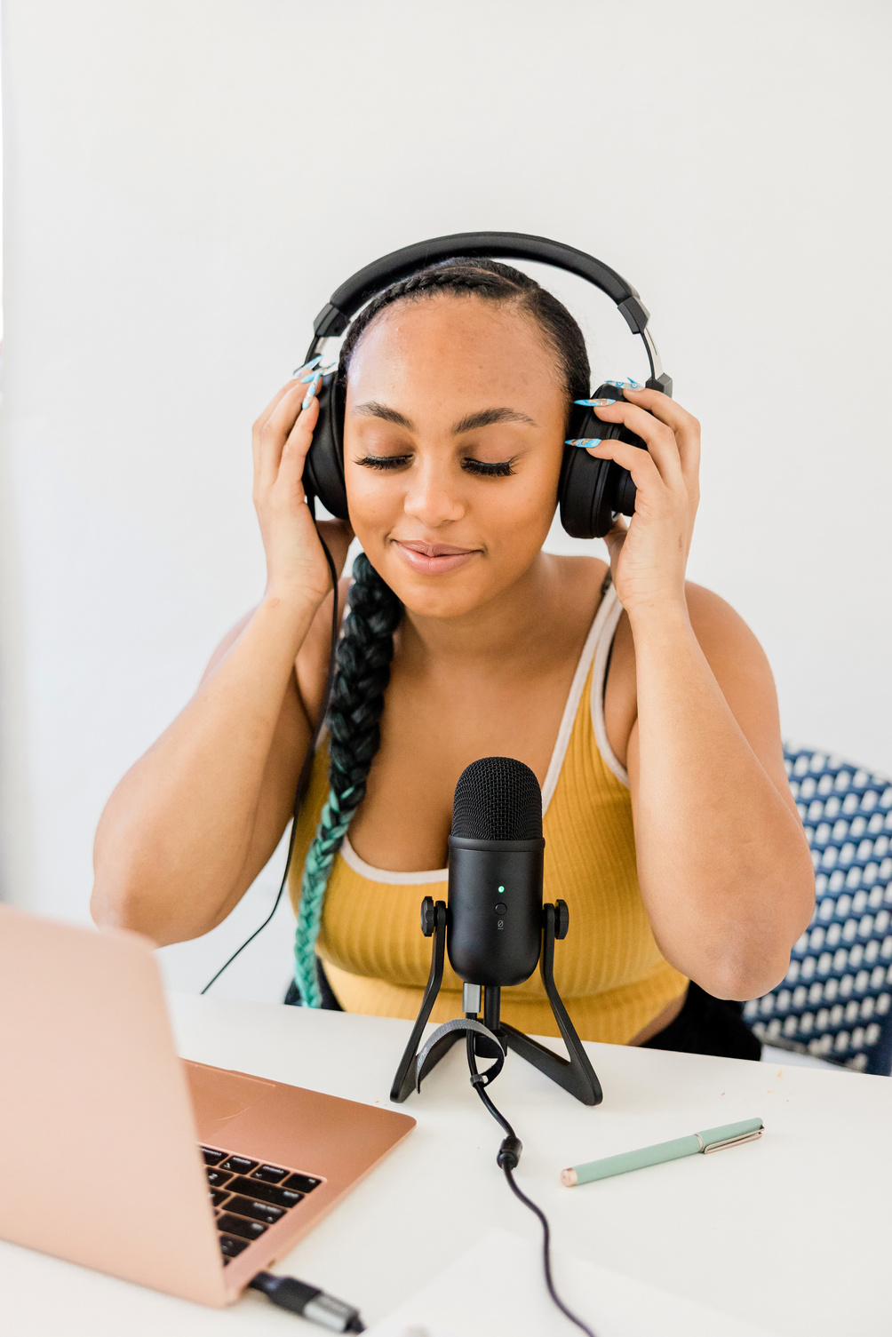 Woman Recording a Podcast at Home